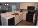 Kitchen with white cabinets, stainless steel appliances, and ample counter space at 1266 River Oaks Dr. # 12-F, Myrtle Beach, SC 29579