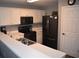 Well-lit kitchen featuring stainless steel appliances, white cabinets, and quartz countertops at 1266 River Oaks Dr. # 12-F, Myrtle Beach, SC 29579