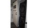 Efficient laundry closet with stacked washer and dryer, located near the bathroom at 1266 River Oaks Dr. # 12-F, Myrtle Beach, SC 29579