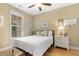 Cozy bedroom with a window, white dresser, and light hardwood floors at 144 Puffin Dr. # 3C, Pawleys Island, SC 29585