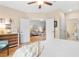 Inviting bedroom with double doors leading to the living area, and ensuite bath at 144 Puffin Dr. # 3C, Pawleys Island, SC 29585