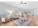 Bright living area with comfortable seating, ceiling fan, and open floor plan to dining at 144 Puffin Dr. # 3C, Pawleys Island, SC 29585