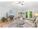 Inviting living room featuring a stylish TV stand, comfortable seating, and outdoor access at 144 Puffin Dr. # 3C, Pawleys Island, SC 29585