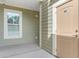 Exterior of a unit displaying a door with unit number and window at 144 Puffin Dr. # 3C, Pawleys Island, SC 29585