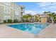Outdoor pool surrounded by comfortable seating and lush greenery at 144 Puffin Dr. # 3C, Pawleys Island, SC 29585