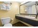 Bright bathroom features a granite-topped sink and fresh, clean towels at 1501 S Ocean Blvd. # 1231, Myrtle Beach, SC 29577