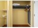 Bright closet with shelving and hanging storage, and an iron/ironing board at 1501 S Ocean Blvd. # 1231, Myrtle Beach, SC 29577