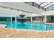 Spacious indoor pool area with a dolphin fountain, ample seating, and a clear ceiling at 1501 S Ocean Blvd. # 1231, Myrtle Beach, SC 29577