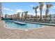 Inviting outdoor pool surrounded by palm trees and lounge chairs, offering a relaxing retreat at 1501 S Ocean Blvd. # 1231, Myrtle Beach, SC 29577