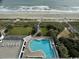 Aerial view of beach and pool area, offering a glimpse of coastal living and amenities at 1905 S Ocean Blvd. # 922-924, Myrtle Beach, SC 29577
