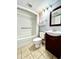 Compact bathroom showcasing a toilet, vanity with dark wood cabinets, and shower-tub combo at 1905 S Ocean Blvd. # 922-924, Myrtle Beach, SC 29577