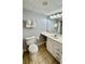 Bright bathroom featuring a large vanity, mirror, and neutral ceramic tiled floors at 1905 S Ocean Blvd. # 922-924, Myrtle Beach, SC 29577