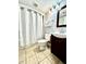 Cozy bathroom featuring a toilet, vanity with dark wood cabinets, and shower with a white curtain at 1905 S Ocean Blvd. # 922-924, Myrtle Beach, SC 29577