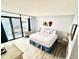 Comfortable hotel bedroom featuring a king-sized bed, ocean view, and wood-look floors at 1905 S Ocean Blvd. # 922-924, Myrtle Beach, SC 29577