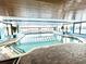 Indoor pool area with tiled deck and blue accent paint in the Ocean Park Resort at 1905 S Ocean Blvd. # 922-924, Myrtle Beach, SC 29577