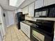 Efficient kitchen with modern appliances, granite countertop, and white cabinets at 1905 S Ocean Blvd. # 922-924, Myrtle Beach, SC 29577