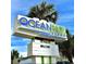 Ocean Park Resort sign, palm trees, and blue sky on a clear day at 1905 S Ocean Blvd. # 922-924, Myrtle Beach, SC 29577