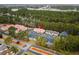 An aerial view of the community showcasing well-maintained buildings, lush trees, and convenient parking areas at 193 Charter Dr. # E7, Longs, SC 29568