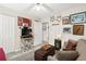 Well-lit bedroom featuring plush carpet, neutral paint, closet, ottoman and couch with decor at 193 Charter Dr. # E7, Longs, SC 29568