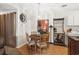Dining area with wood table, wine rack, and a decorative pendant light fixture at 193 Charter Dr. # E7, Longs, SC 29568