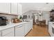 Bright kitchen with sleek white cabinets and modern appliances offering a seamless cooking experience at 193 Charter Dr. # E7, Longs, SC 29568