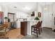 Charming kitchen with white cabinetry, modern appliances, wine rack, and eat-in bar area at 193 Charter Dr. # E7, Longs, SC 29568