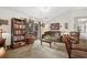 Comfortable living room with a vaulted ceiling, soft carpet, and a sliding door to the porch at 193 Charter Dr. # E7, Longs, SC 29568