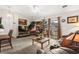 Cozy living room with a vaulted ceiling, soft carpet, and sliding doors to the outdoor patio at 193 Charter Dr. # E7, Longs, SC 29568