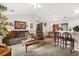 Comfortable living room with an open layout, vaulted ceiling, carpeted floor, and modern lighting at 193 Charter Dr. # E7, Longs, SC 29568
