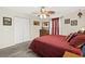 Well-lit main bedroom with a ceiling fan, closet, and neutral decor at 193 Charter Dr. # E7, Longs, SC 29568