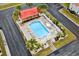 Aerial view of a community pool surrounded by lush landscaping, white fencing and ample parking at 193 Charter Dr. # E7, Longs, SC 29568
