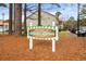 A 'Welcome to Colonial Gardens I & II' sign is the entry to this desirable neighborhood at 193 Charter Dr. # E7, Longs, SC 29568