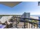 Balcony view of the ocean and resort-style neighborhood, including palm trees at 2001 S Ocean Blvd. # 914, Myrtle Beach, SC 29577