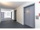 Hallway featuring multiple elevators with textured walls and clear signage for easy access at 2001 S Ocean Blvd. # 914, Myrtle Beach, SC 29577
