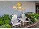Inviting entrance with white chairs and the 'Blue Water Resort' sign surrounded by greenery at 2001 S Ocean Blvd. # 914, Myrtle Beach, SC 29577
