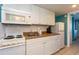 Bright kitchen features white cabinetry, essential appliances, and functional countertop space at 2001 S Ocean Blvd. # 914, Myrtle Beach, SC 29577