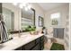 Clean bathroom with dark vanity, marble countertops, and modern fixtures at 2170 Deerfield Ave., Surfside Beach, SC 29575