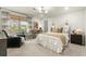 Bright bedroom with a comfortable bed, stylish furniture, and natural light from large windows at 2170 Deerfield Ave., Surfside Beach, SC 29575