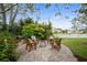 Backyard fire pit seating area with Adirondack chairs and views of the lake at 2170 Deerfield Ave., Surfside Beach, SC 29575