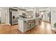 Kitchen featuring a large island with a marble countertop and barstool seating, as well as stainless appliances at 2170 Deerfield Ave., Surfside Beach, SC 29575