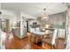 Charming eat-in kitchen with custom cabinets, an island with seating, and a decorative light fixture at 2170 Deerfield Ave., Surfside Beach, SC 29575