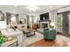 Comfortable living room featuring a fireplace, hardwood floors, and stylish furnishings at 2170 Deerfield Ave., Surfside Beach, SC 29575