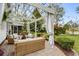 Inviting outdoor patio area with comfortable seating, a pergola, and serene views of the lush backyard at 2170 Deerfield Ave., Surfside Beach, SC 29575