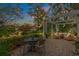 Backyard fire pit seating area with Adirondack chairs, string lights and views of the lake at 2170 Deerfield Ave., Surfside Beach, SC 29575