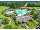Aerial shot showcases a community pool, clubhouse, and landscaping at 2204 Woodstork Dr., Conway, SC 29526
