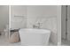 A stylish bathroom with a soaking tub, marble accent wall, and modern fixtures at 2204 Woodstork Dr., Conway, SC 29526