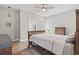 Cozy bedroom with a bed, hardwood floors, a ceiling fan, and neutral paint at 2204 Woodstork Dr., Conway, SC 29526