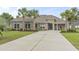 Well-manicured lawn and landscaping highlight this beautiful home with a large concrete driveway at 2204 Woodstork Dr., Conway, SC 29526