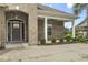 Charming brick home featuring an arched entryway, covered porch, and well-maintained landscaping at 2204 Woodstork Dr., Conway, SC 29526