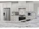 Close-up of a modern kitchen with granite countertops and stainless steel appliances at 2204 Woodstork Dr., Conway, SC 29526